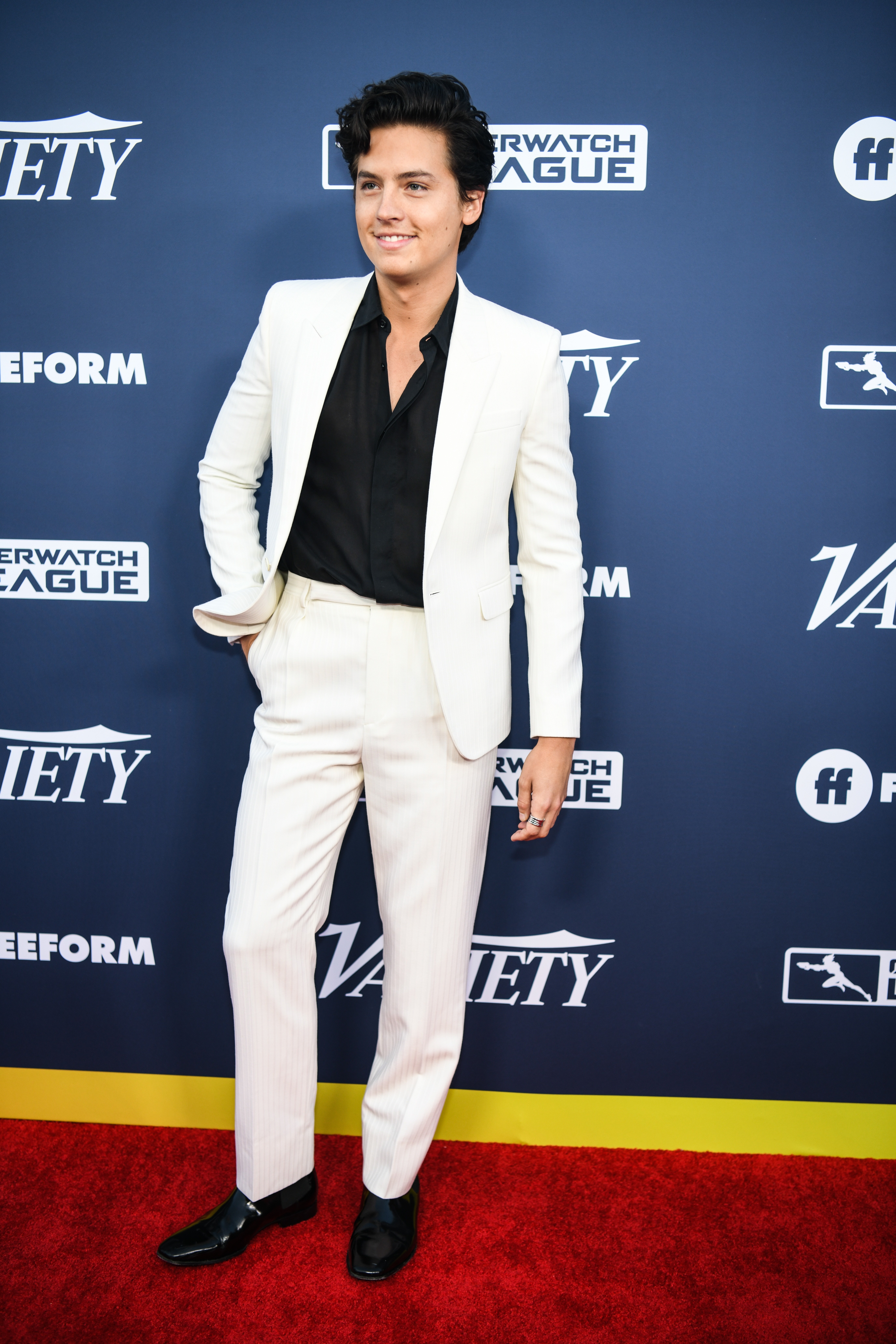 white suit red carpet